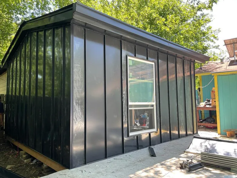 Black standing seam metal wall panels for Roof Inspection in Indian Harbour Beach