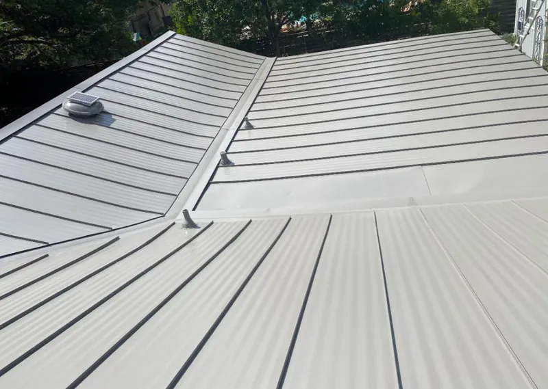 Solar attic fan installed on a metal roof for Roof Ventilation in Indian Harbour Beach